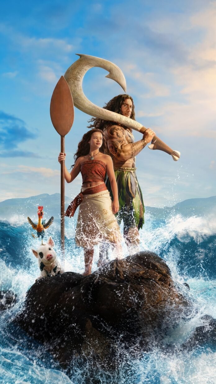 Moana and Maui stand on ocean rocks in the official poster for Disney’s live-action Moana