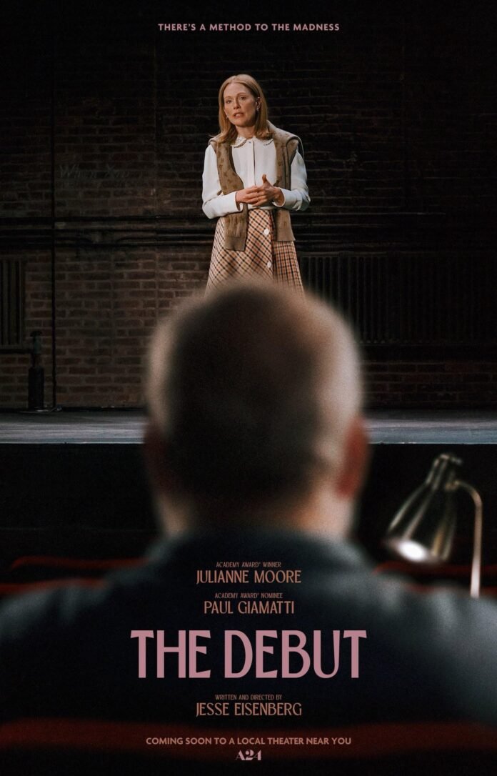 Official poster for The Debut featuring Julianne Moore standing on a stage while an audience member watches from the foreground.