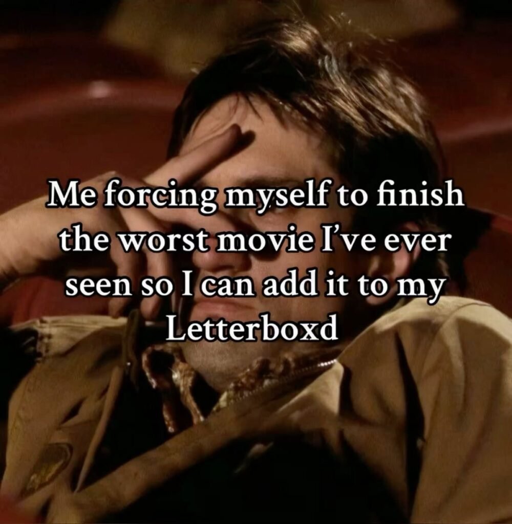 A person watches a movie with a tired expression as the meme jokes about finishing a bad film just to log and review it on Letterboxd.