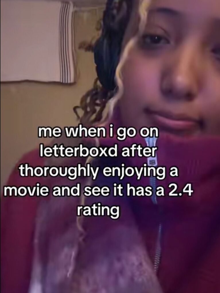 A person gives a disappointed expression while the meme jokes about discovering a favorite movie has a very low Letterboxd score.